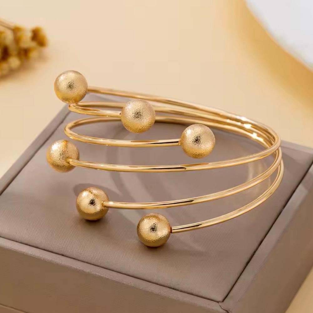 Elegant Gold Spiral Bracelet